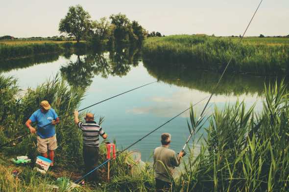 Fishermen by a lake